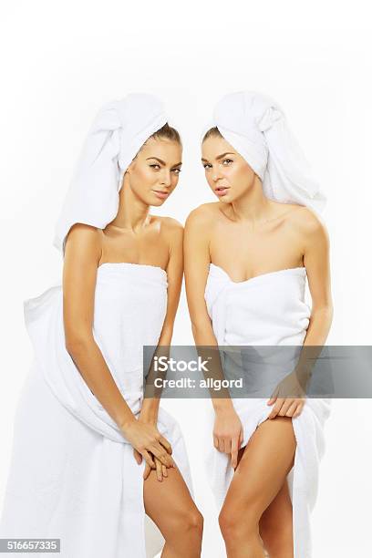 Two Happy Teenage Girls After Showering In Towels Stock Photo - Download Image Now - Adult, Adults Only, Body Care