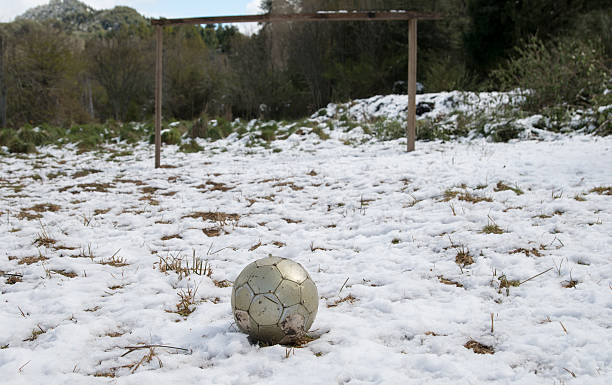 istock Football in Snow 516657571