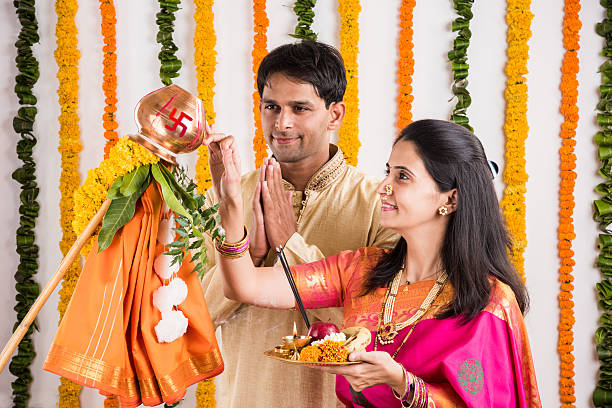 istock smart indian couple performing gudhi padwa puja 516657628
