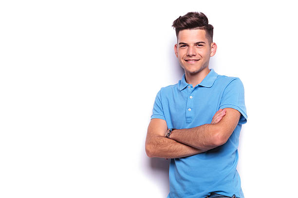 istock young man in blue polo shirt posing in white studio 516657706