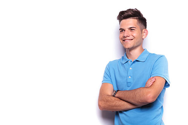 istock young man in blue polo shirt posing hands crossed 516657762