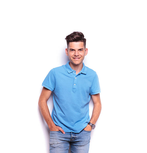 istock boy in polo shirt posing with hands in pockets 516658240
