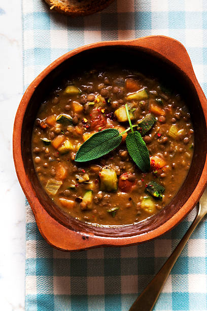istock lentil Soup with Crusty Bread on the table 516658502