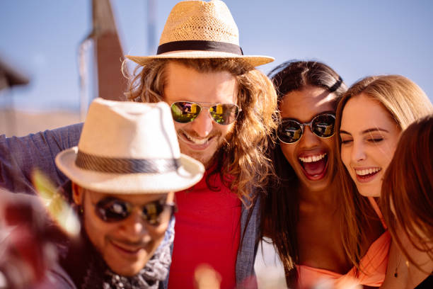 istock Multi ethnic group of friends taking selfie on summer day 516659054
