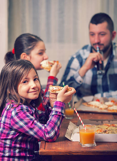 istock Family or friends sharing a pizza 516659142