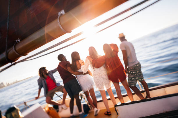 istock Multi ethnic group  friends looking at horizon from a yacht 516659928