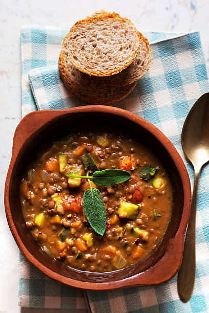 istock lentil Soup with Crusty Bread on the table 516660368