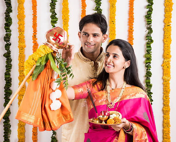istock smart indian couple performing gudhi padwa puja 516660678