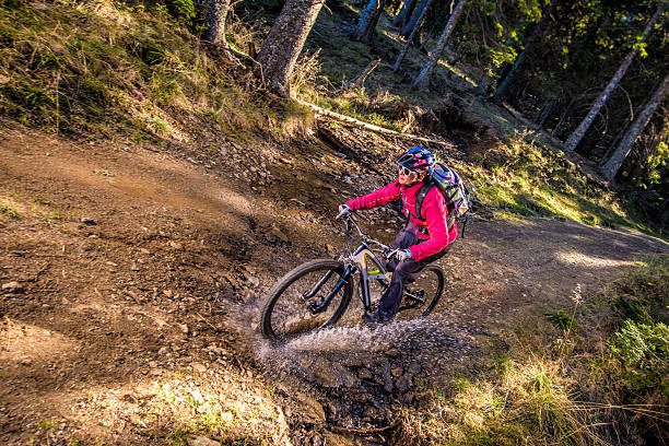 istock Woman enjoying mountain biking 516679314