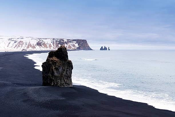 istock View on black sand Reynisfjara beach and volcanic rocks,Iceland 516680276