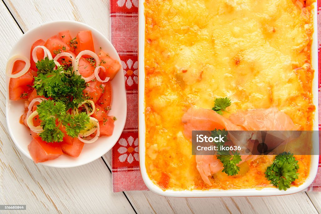 Casserole with smoked salmon, potatoes, leek and cheese. Baked Stock Photo