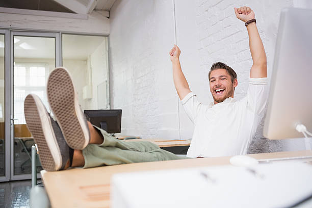 istock Cheerful businessman cheering in office 516681123