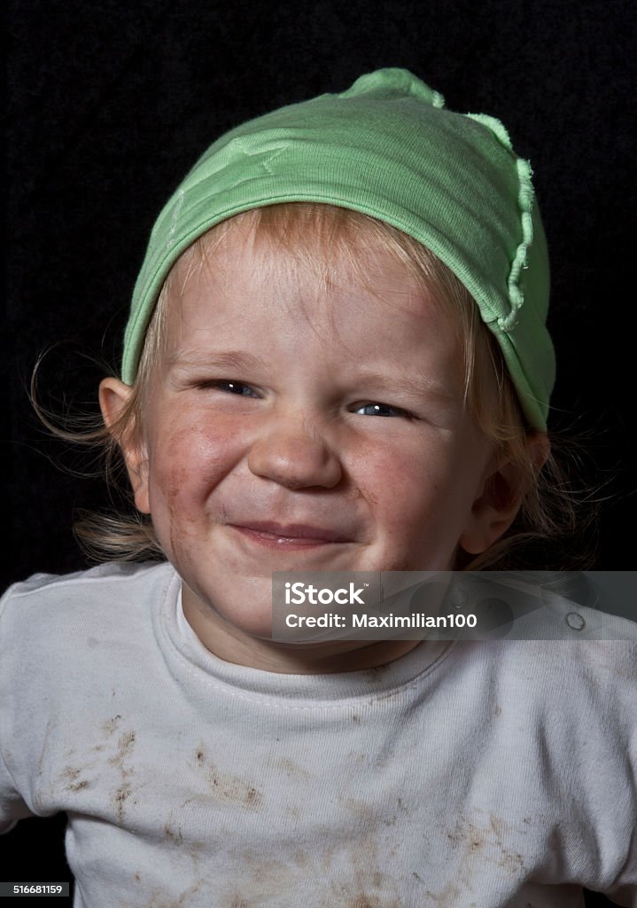 poor laughing child poor laughing child on black background Child Stock Photo