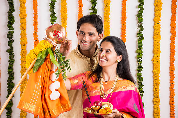 istock smart indian couple performing gudhi padwa puja 516681394