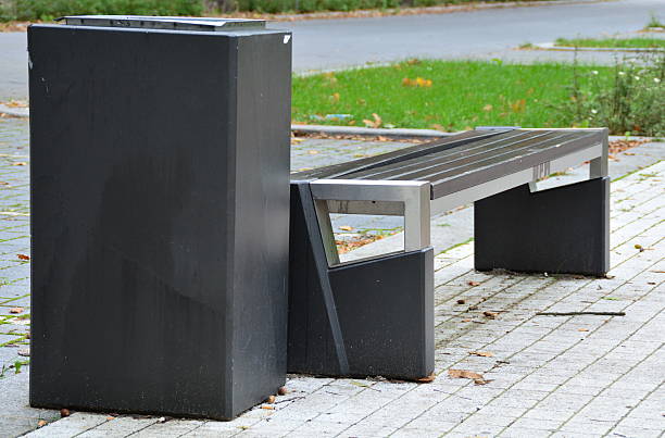 istock Urban bench with a basket of Garbage 516682811