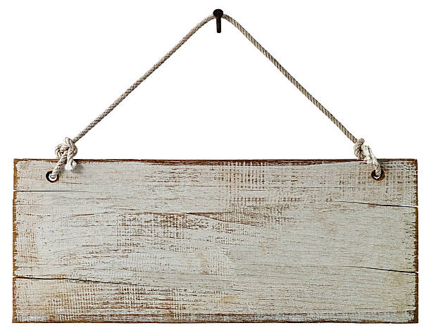 istock Old weathered white wood signboard. 516683588