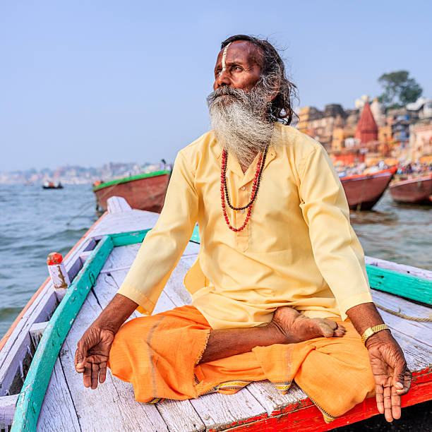 istock Sadhu is meditating in boat on Holy Ganges River, Varanasi 516683592