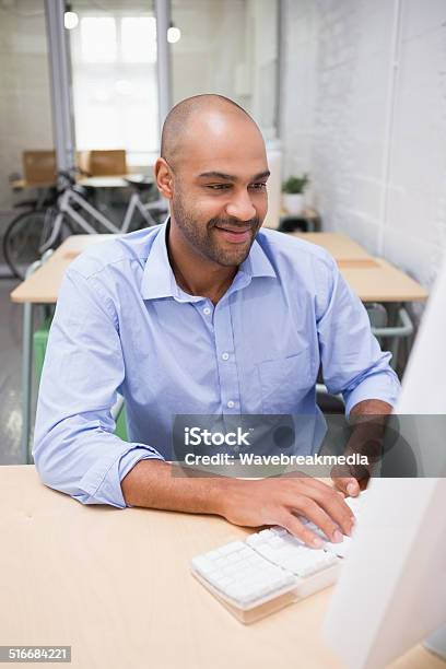 Businessman Using Computer At Desk Stock Photo - Download Image Now - 30-39 Years, 35-39 Years, Adult