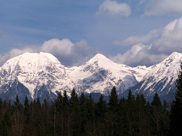 istock alpine mountains in winter time 516684381