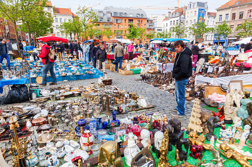 Brussels, Belgium - May 17, 2015: famous flea market in the Marolles district in Brussels with unidentified people. Brussels is famous for its flea markets and antiquities.