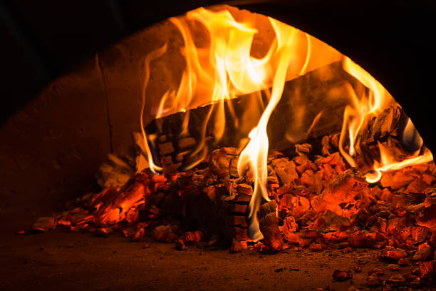 istock fire in the oven.  Traditional Pizza oven 516685020