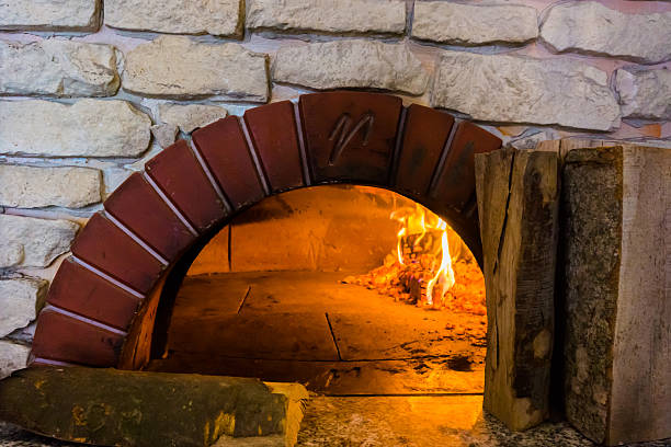 istock fire in the oven.  Traditional Pizza oven 516685098