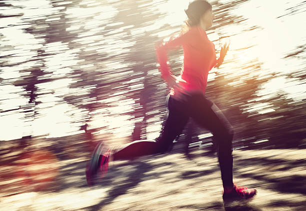 istock Adult woman running outdoors concept 516685938