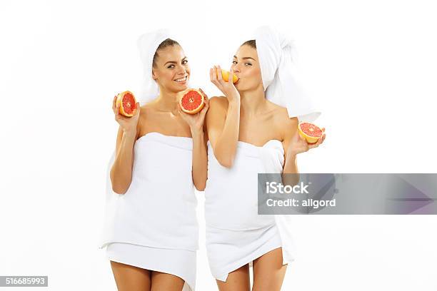 Two Happy Teen Girl After Shower Playing With Grapefruit Stock Photo - Download Image Now