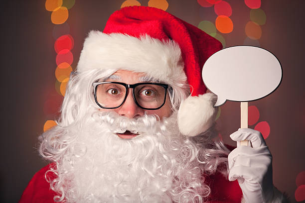 istock Santa Claus Holding Blank Talk Bubble 516686135