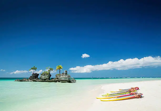 Photo of tropical beach and christian shrine on boracay island philippines