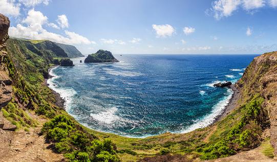 Panoramic view of Cape Ponta do Albarnaz with Maria Vaz Islet (named for one of the original settlers of Flores, a small pyramidal islet in the bay of Ponta Delgada along its western coast) on Flores Island (Azores/Portugal).