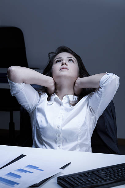 istock Tired woman during overtime 516688285