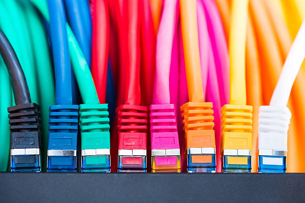 Network Cables Colorful network cables connected to a switch computer cable photos stock pictures, royalty-free photos & images