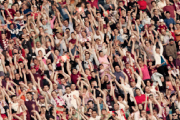 istock crowd of people at the stadium - defocused background 516689040