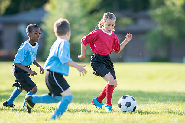 istock Kicking a Ball Up the Field 516689144