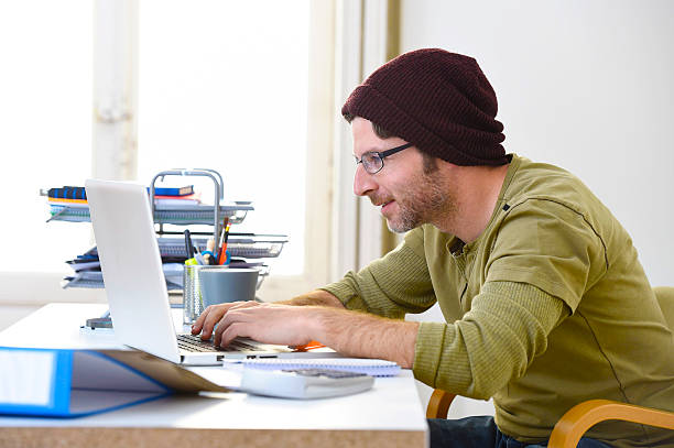 istock hipster businessman working from home office as freelancer creative business 516689250