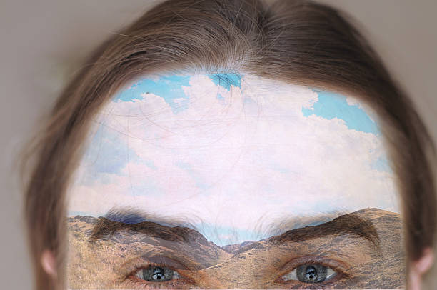 istock double exposion image of man forehead and sky and mountains 516689958