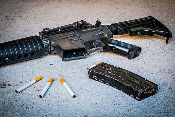 istock cigarette in Magazine gun.Customizable dark tones. 516690188