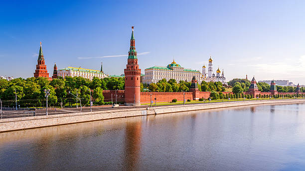 View of the Moscow Kremlin View of the Moscow Kremlin in the morning with Big Stone Bridge moscow russia stock pictures, royalty-free photos & images