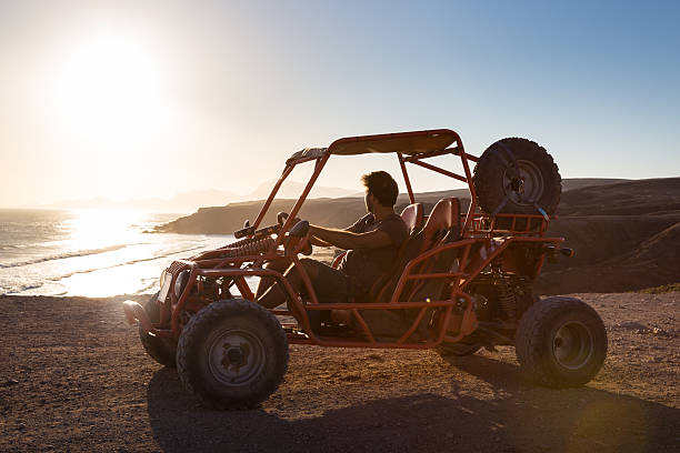 istock Man driving quadbike in sunset. 516691346