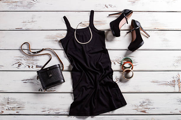 istock Black female outfit on table. 516691940