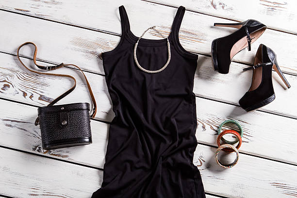 istock Black dress and small necklace. 516691982