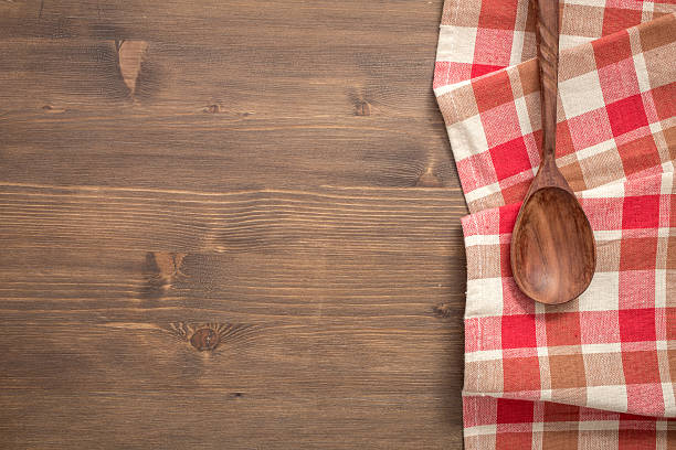 istock Checkered napkin from right side of wooden background 516692012