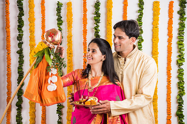 istock smart indian couple performing gudhi padwa puja 516692306