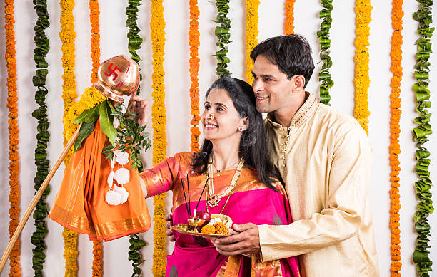 istock smart indian couple performing gudhi padwa puja 516692618