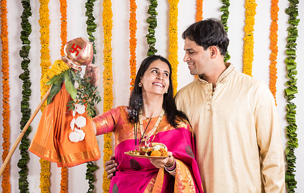 istock smart indian couple performing gudhi padwa puja 516693074