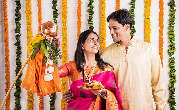 istock smart indian couple performing gudhi padwa puja 516693980
