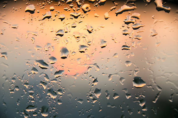 istock water bubble drop, rain drop on glass and dripping down 516694848