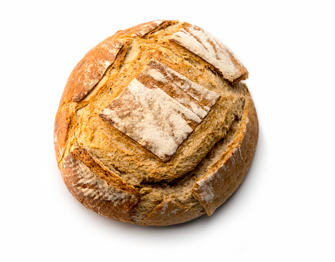 High angle view of a fresh loaf of homemade bread on white background