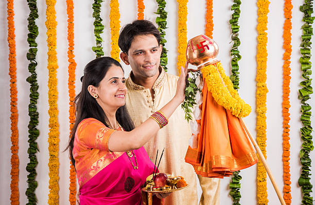 istock smart indian couple performing gudhi padwa puja 516714198